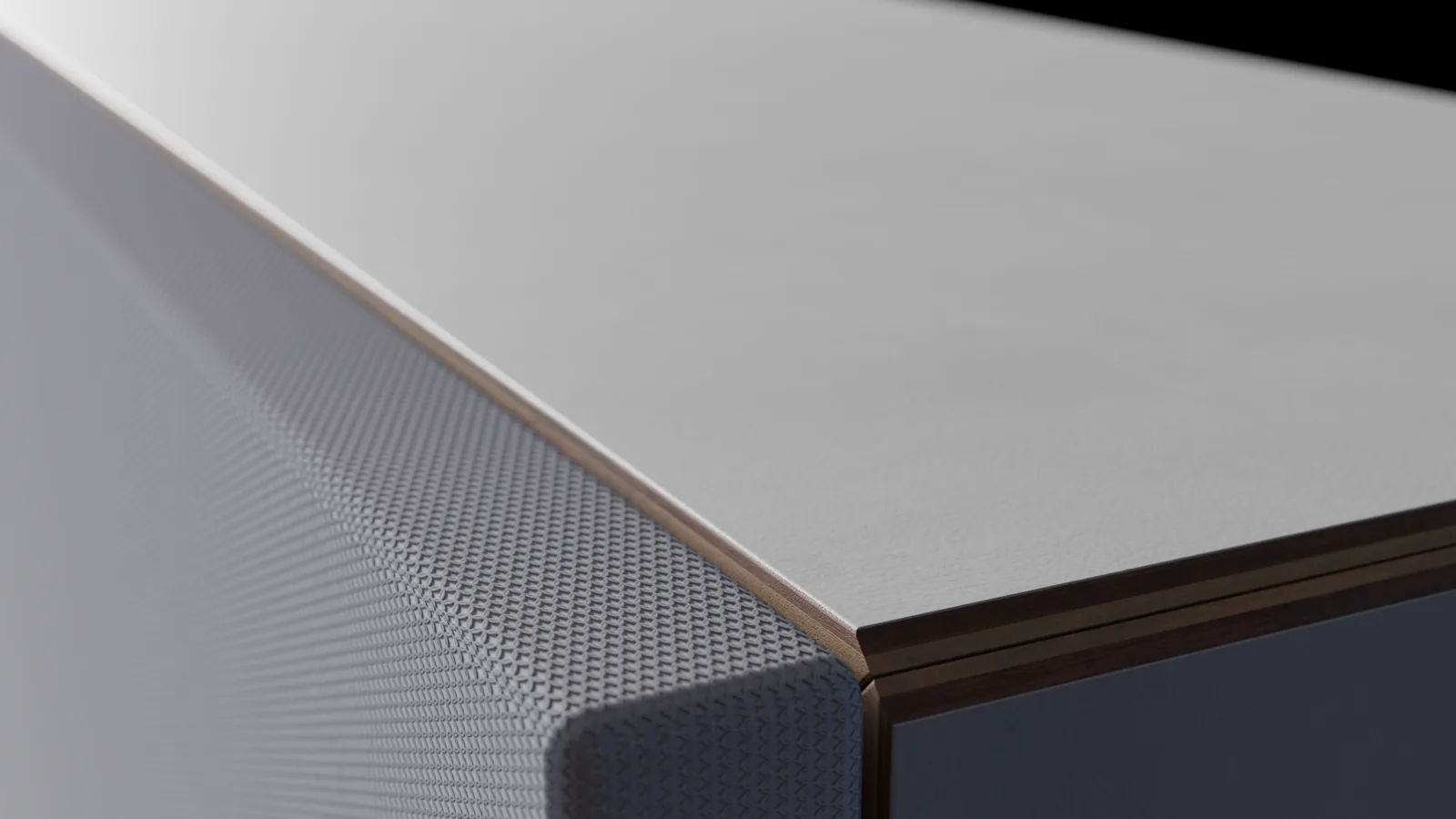 Close view of the textile face, timber edge and fabric-covered depth of Studio 200