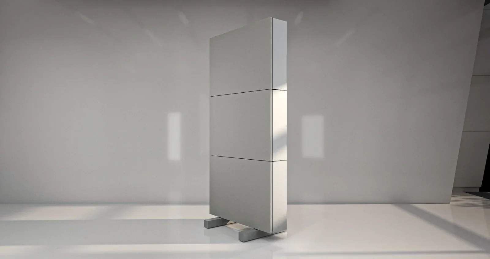 A freestanding PX-System Studio partition of three Air panels on two feet, in a daylit room
